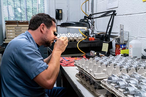 jerry inspecting machined parts